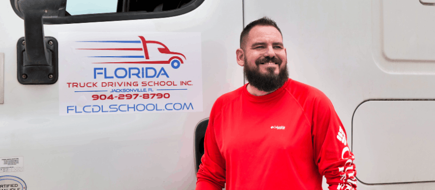 Shawn standing in front of Florida semi truck
