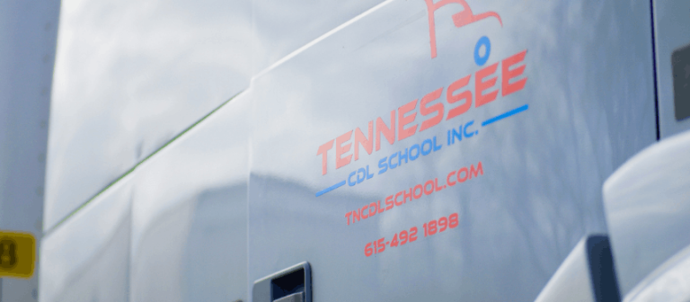 Closeup of Tennessee CDL School semi truck door with logo