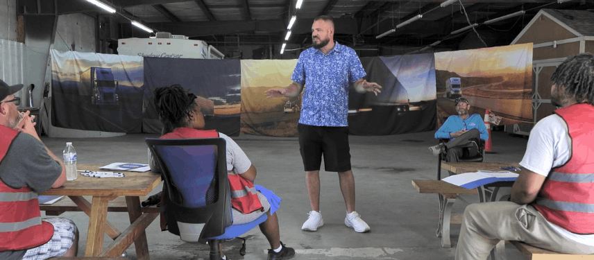 Shawn Davis teaching students in an outdoor classroom